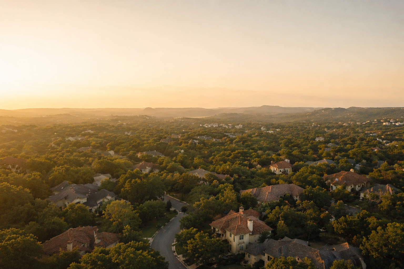 Aerial view of San Antonio Hill Country residential neighborhood at sunset